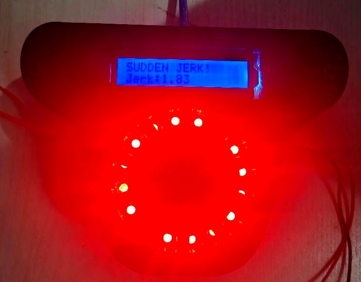 The device displaying a sudden jerk alert, glowing red