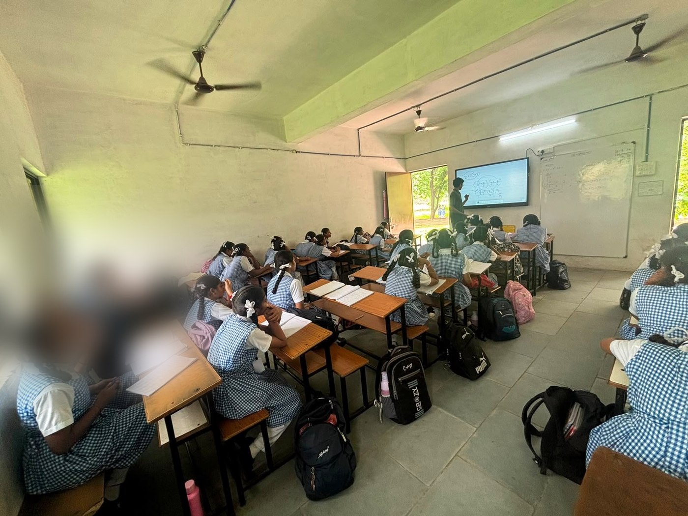 Students at their desks during a classroom lesson